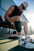 Cordless red light therapy wrap on knee, athletic recovery courtside